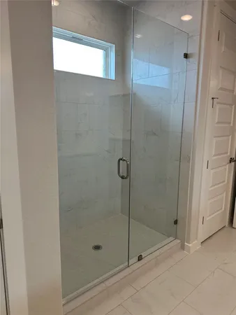 a bathroom with a double vanity sink and mirror