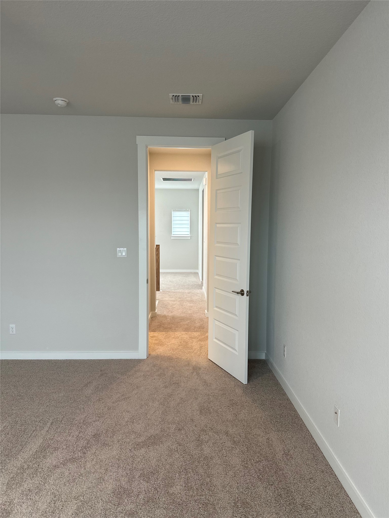 412 Lariat Loop Liberty Hill, TX 78642 - Photo 28 of 38 Spare room featuring carpet floors, visible vents, and baseboards
