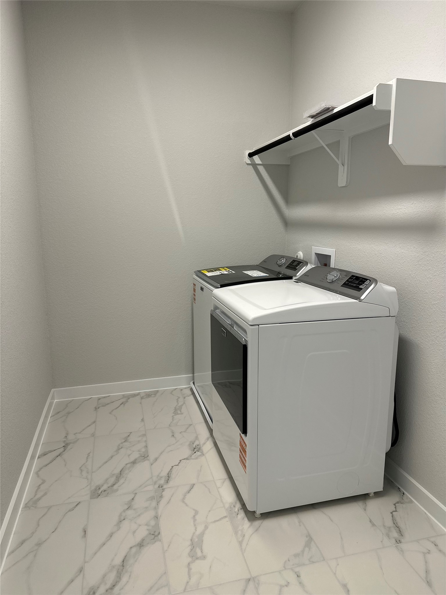 412 Lariat Loop Liberty Hill, TX 78642 - Photo 29 of 38 a utility room with dryer and washer