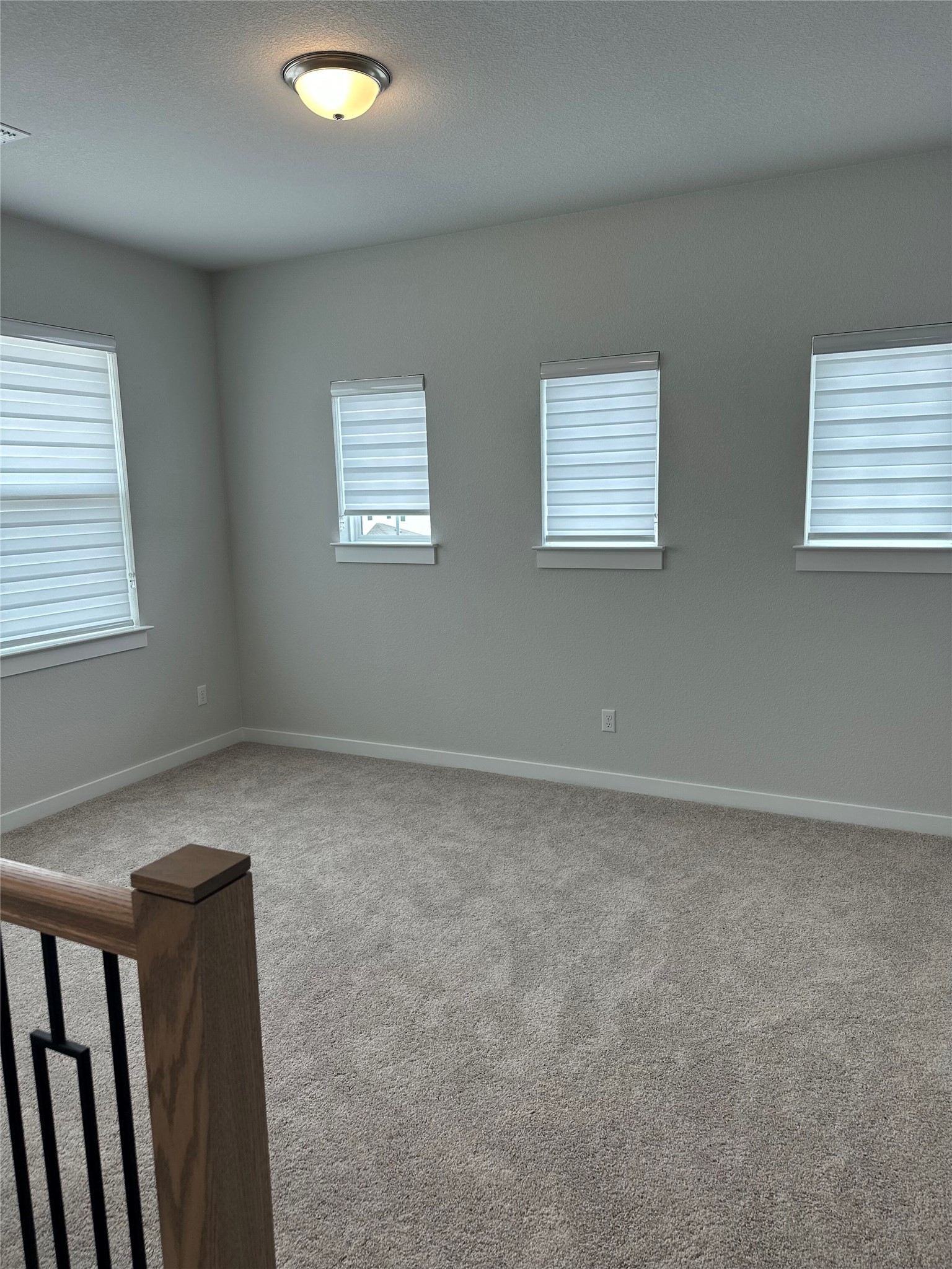 412 Lariat Loop Liberty Hill, TX 78642 - Photo 30 of 38 a view of an empty room with wooden floor and a window