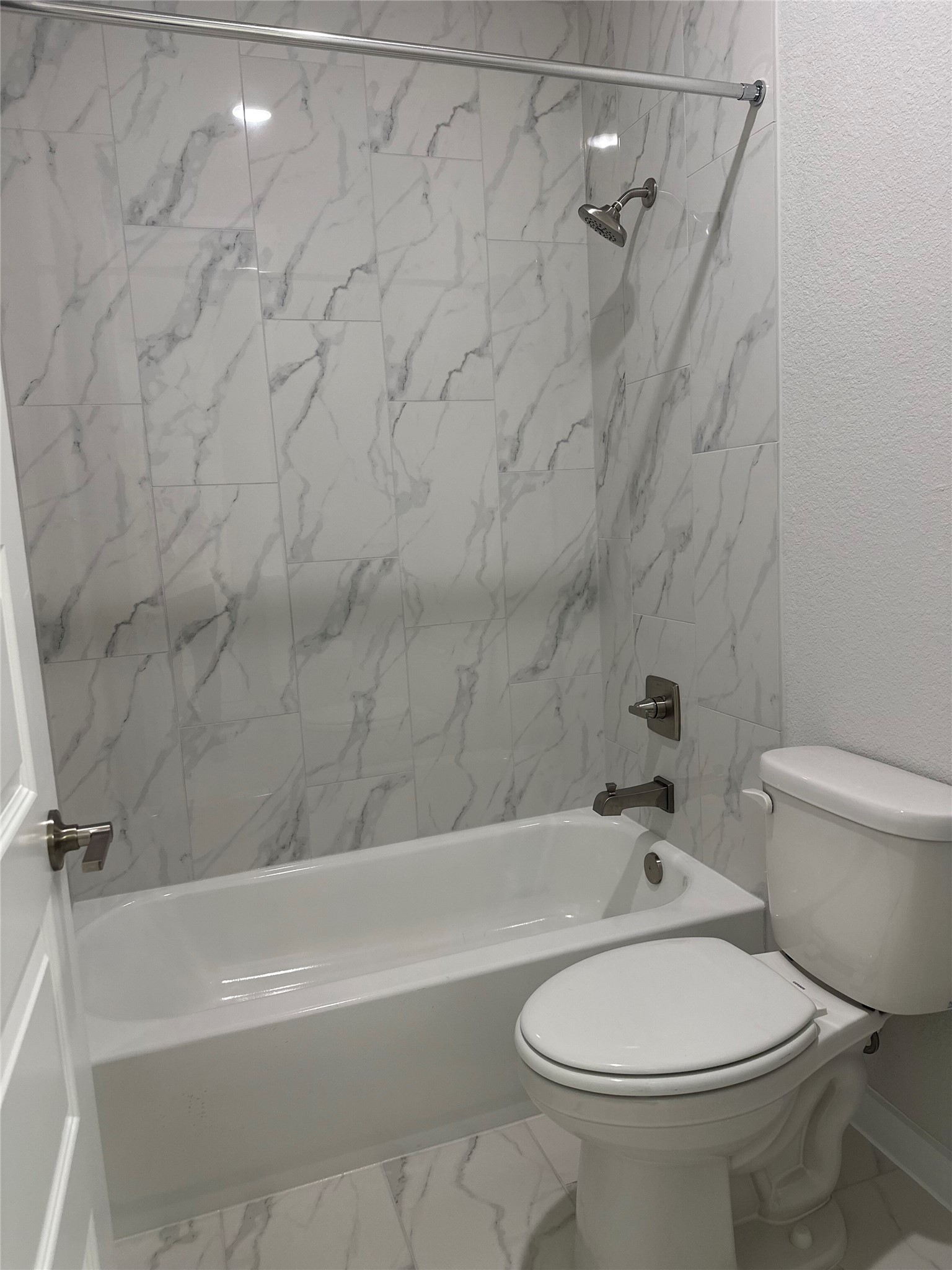 412 Lariat Loop Liberty Hill, TX 78642 - Photo 31 of 38 a bathroom with a toilet and a bathtub