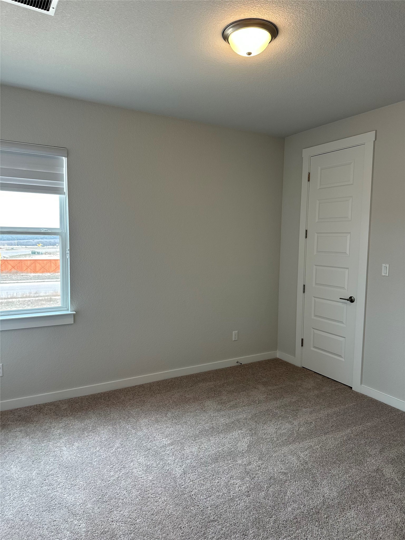 412 Lariat Loop Liberty Hill, TX 78642 - Photo 32 of 38 an empty room with a window
