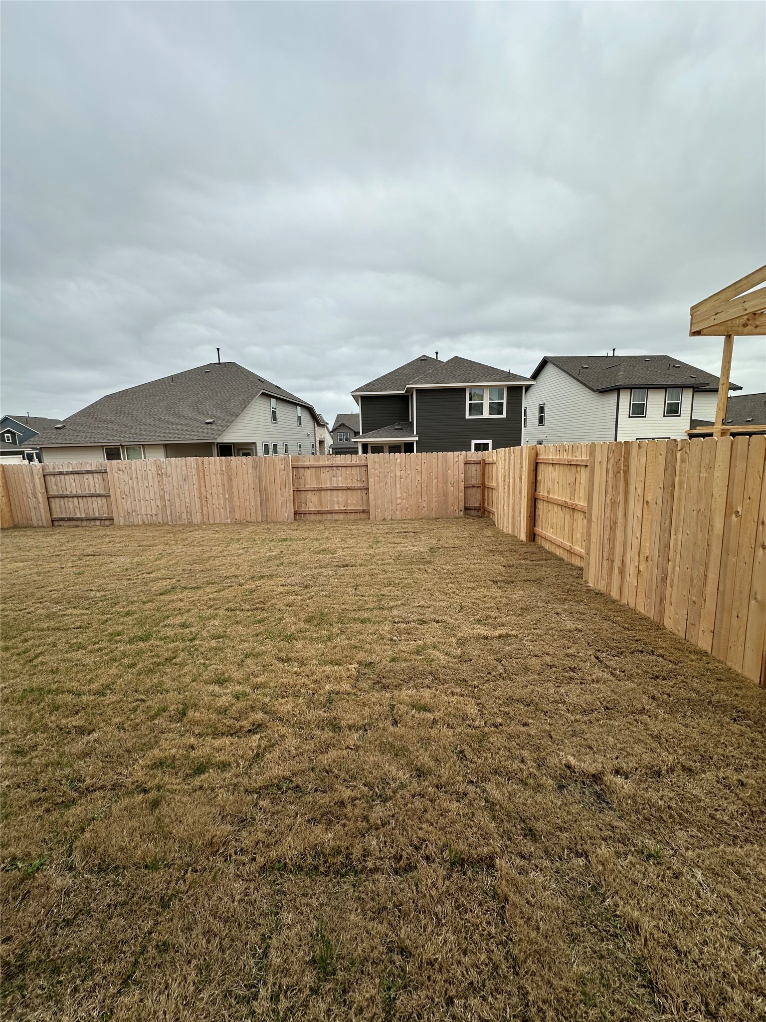 412 Lariat Loop Liberty Hill, TX 78642 - Photo 35 of 38 a big white house with a big yard and large trees