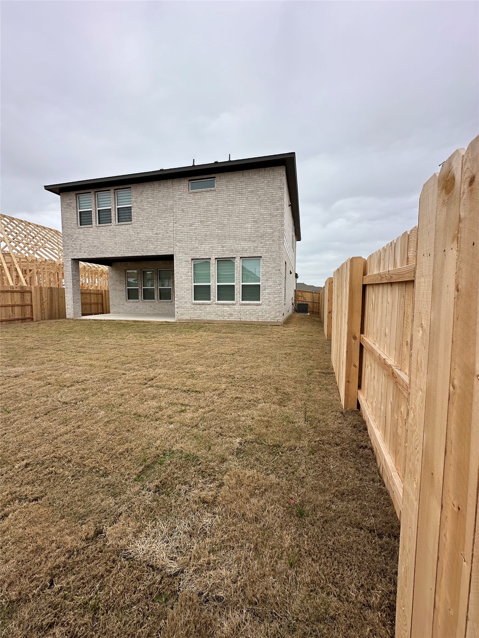 412 Lariat Loop Liberty Hill, TX 78642 - Photo 38 of 38 Back of property with a fenced backyard and a yard
