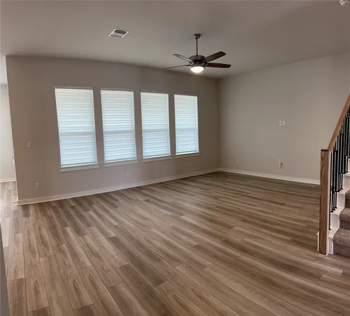 a kitchen with a sink cabinets and a window