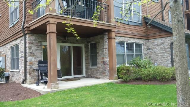 a view of a house with a yard and plants