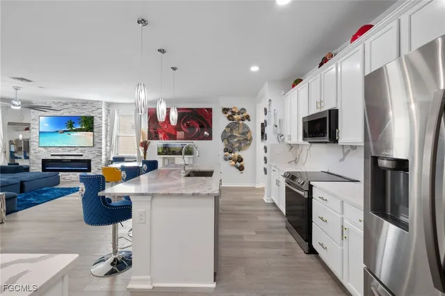 a living room with granite countertop furniture and fireplace