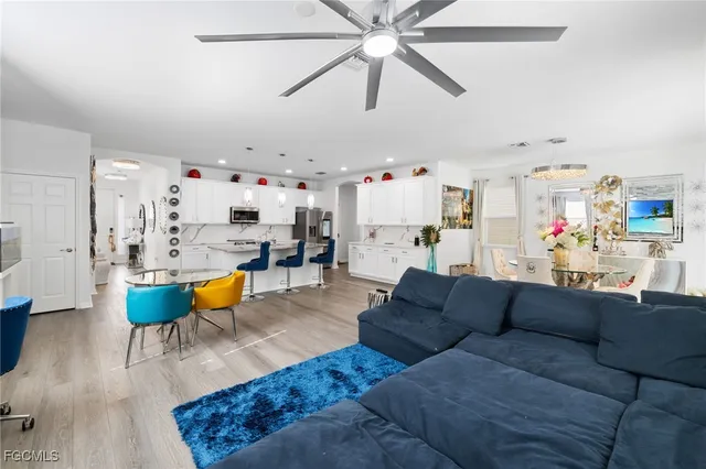 a view of a dining room with furniture wooden floor and a chandelier