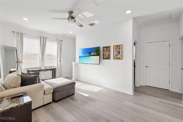 a bedroom with a bed and a chair