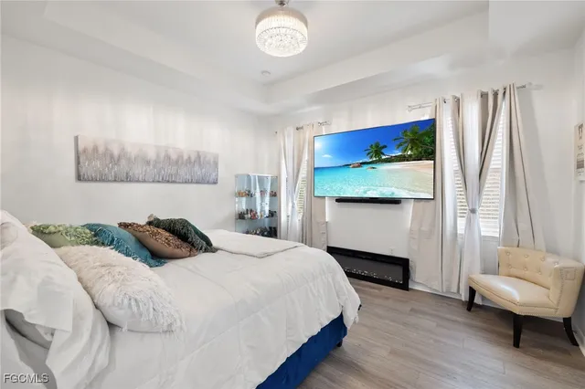 a bedroom with a bed and a night stand