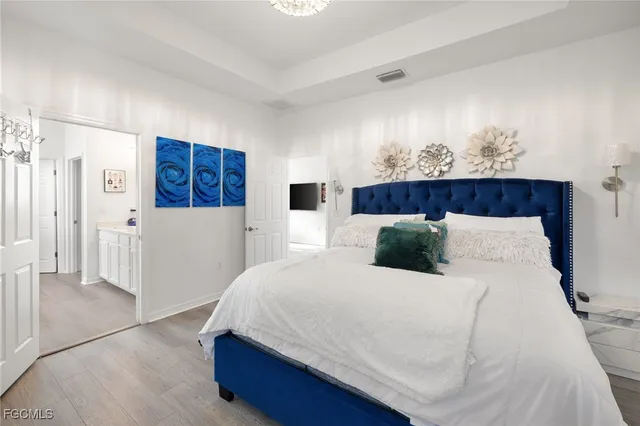 a bathroom with a bathtub sink and mirror
