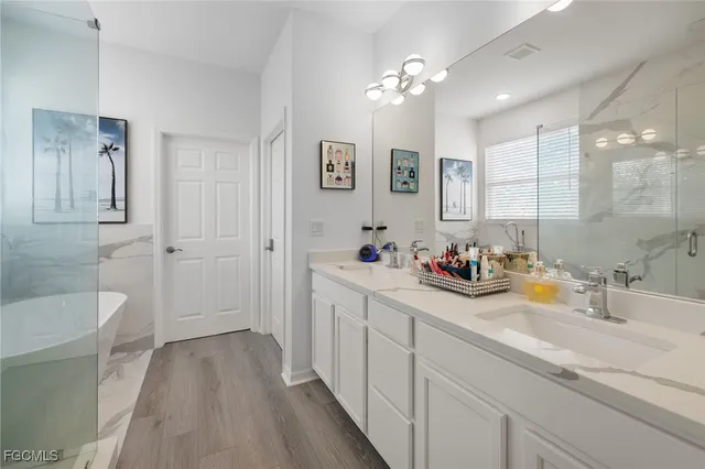 a bathroom with a bathtub and a shower
