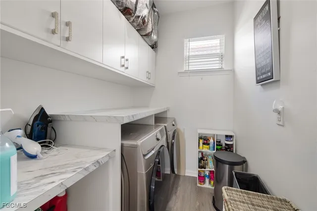 a bathroom with a sink and a blue curtain