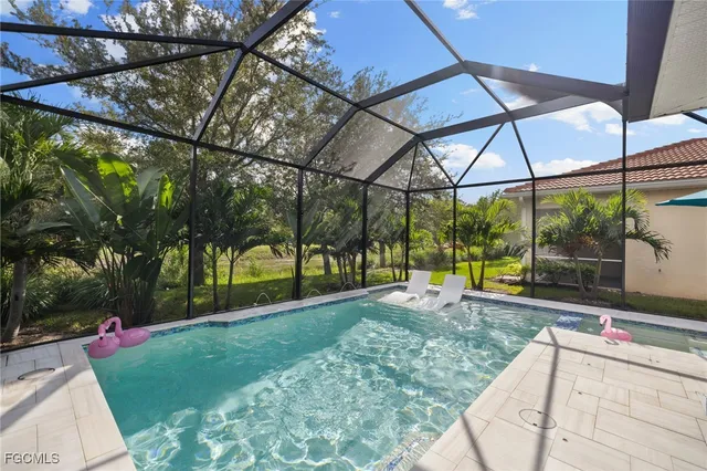 a view of a swimming pool with a patio