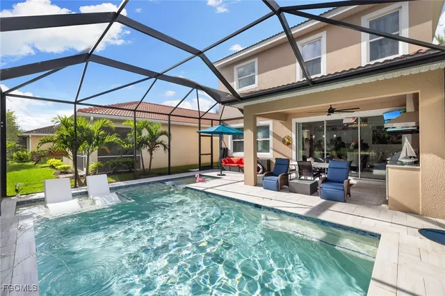 a view of a backyard with sitting area