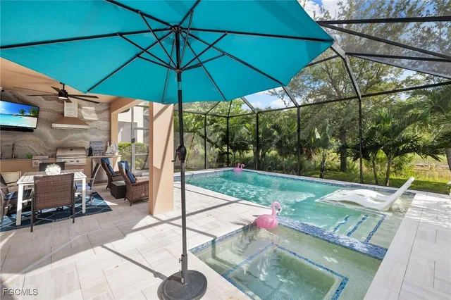 a view of a backyard with a patio and a garden