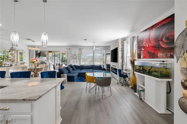 a large white kitchen with cabinets