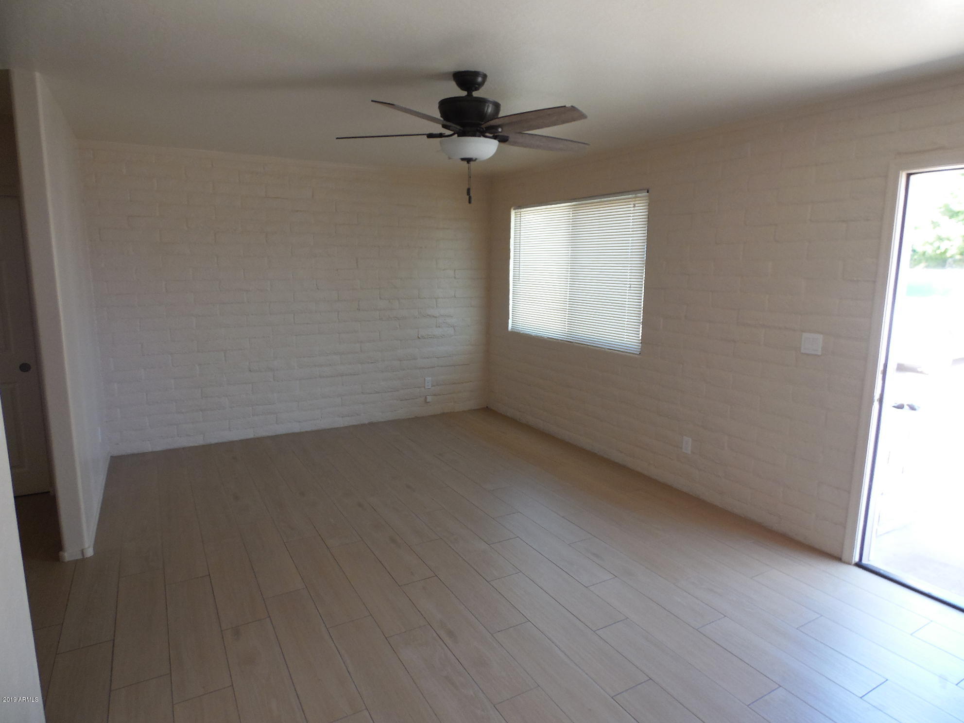438 South Hobson, Unit 442 Mesa, AZ 85204 - Photo 2 of 7 an empty room with a window