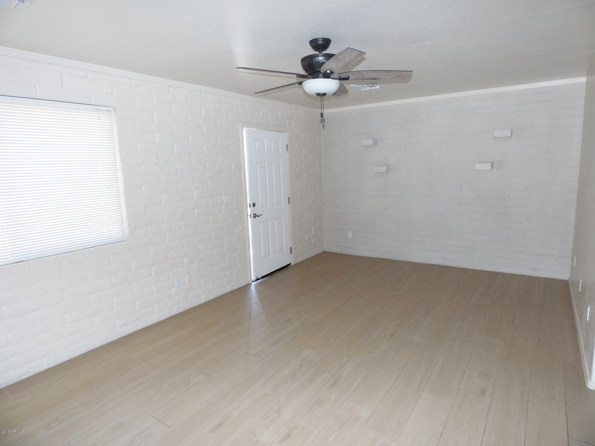 438 South Hobson, Unit 442 Mesa, AZ 85204 - Photo 3 of 7 wooden floor in an empty room