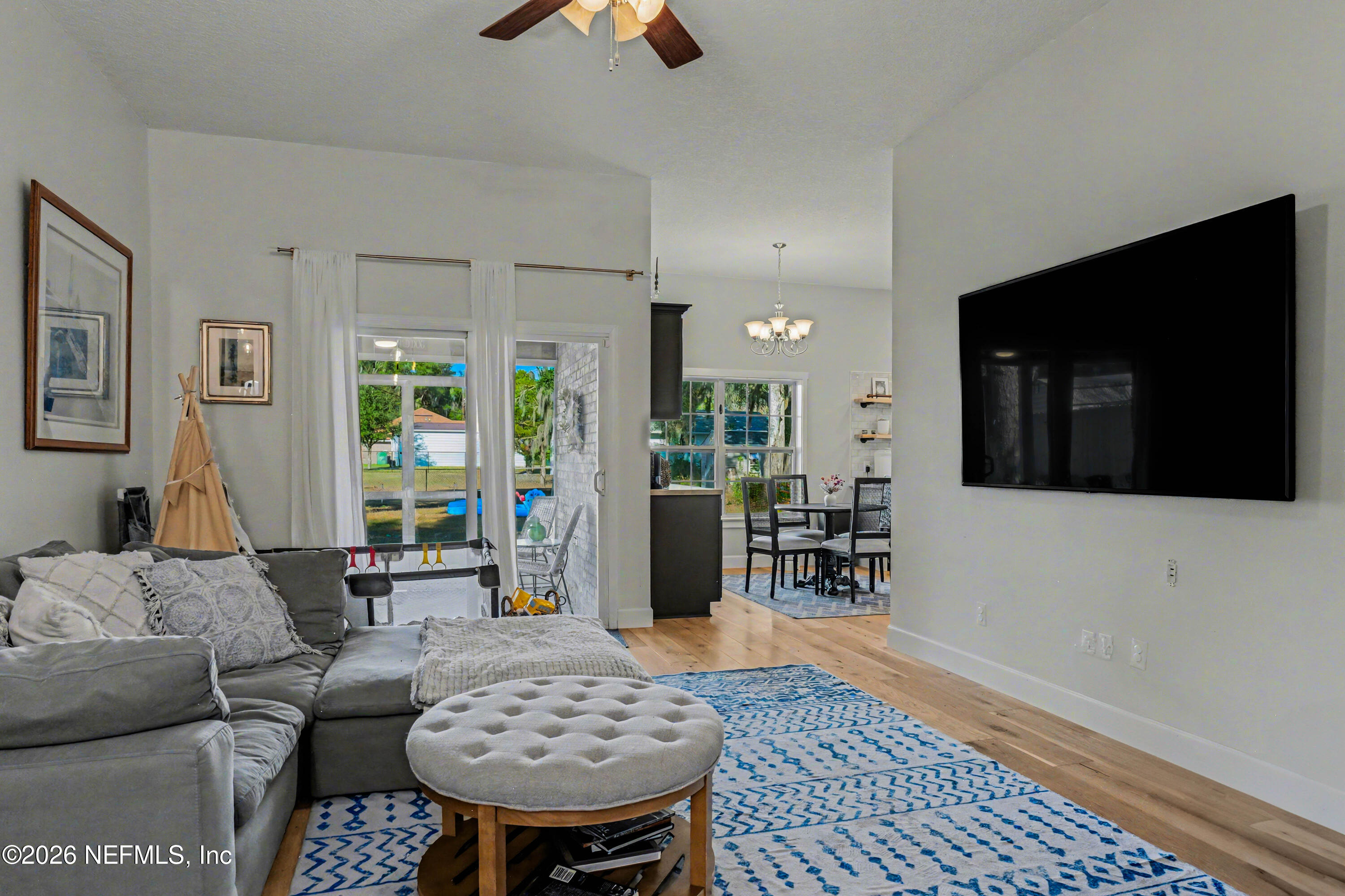 87159 Chesapeake Avenue Yulee, FL 32097 - Photo 14 of 46 a living room with furniture and a flat screen tv