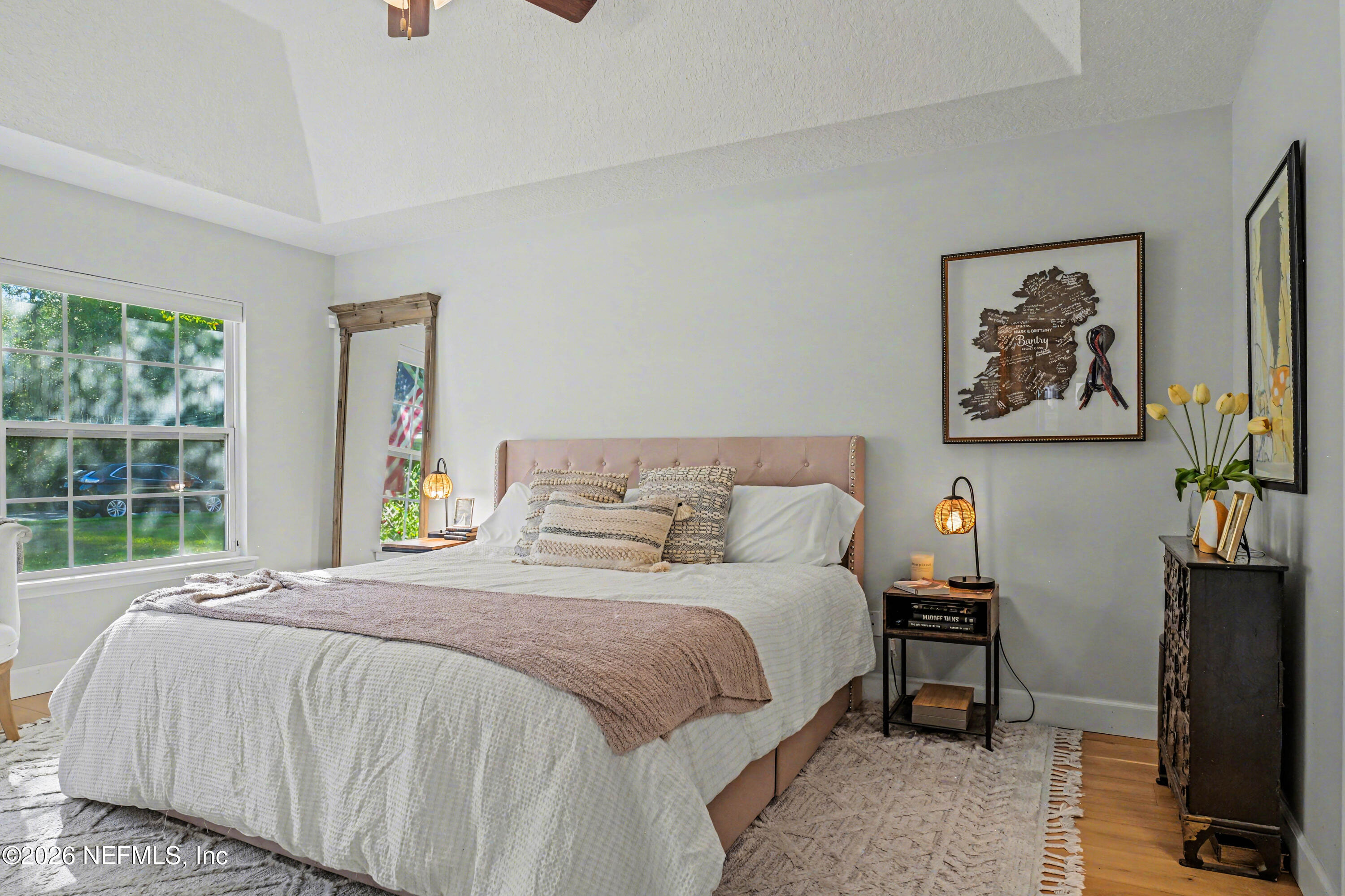 87159 Chesapeake Avenue Yulee, FL 32097 - Photo 15 of 46 a bedroom with a bed and a window