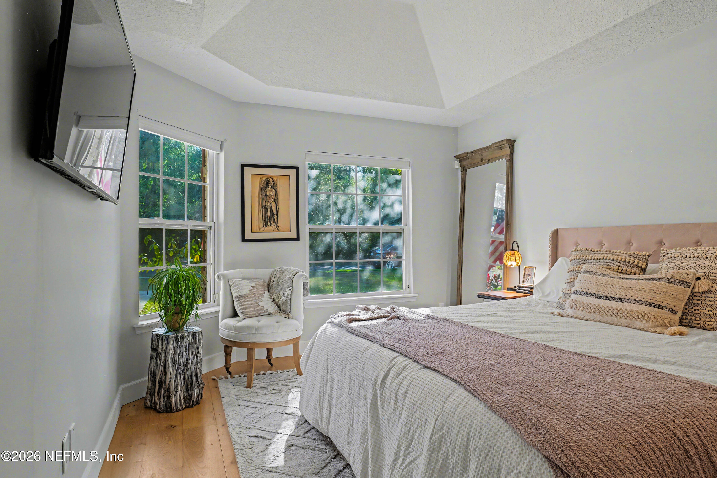 87159 Chesapeake Avenue Yulee, FL 32097 - Photo 16 of 46 a bedroom with a bed and a flat screen tv