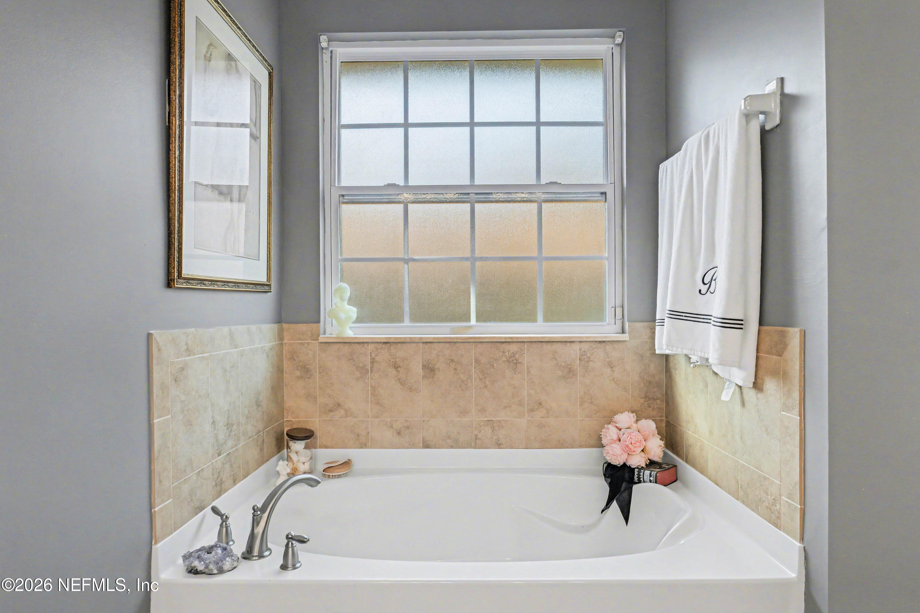 87159 Chesapeake Avenue Yulee, FL 32097 - Photo 23 of 46 a bath tub sitting next to a window