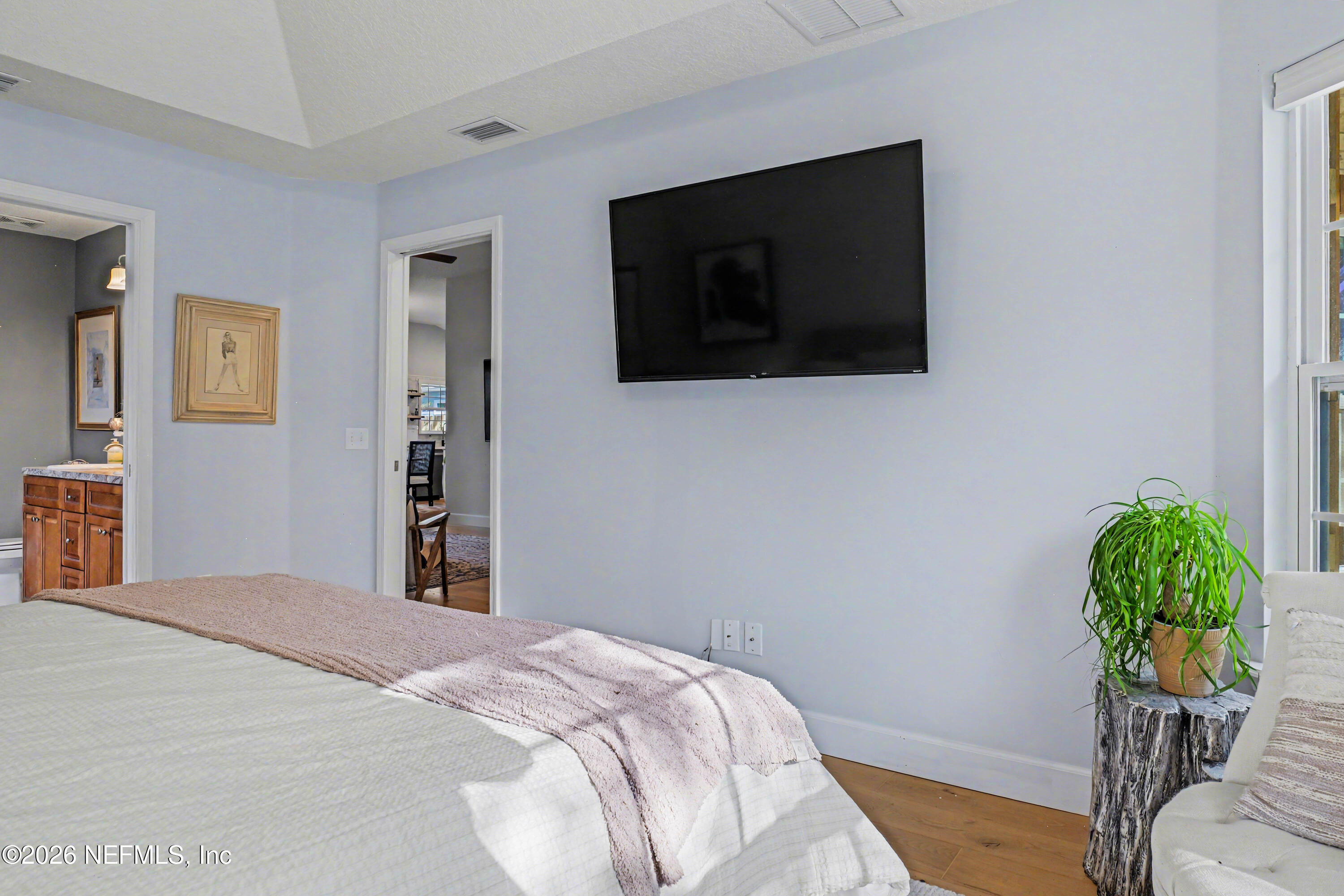 87159 Chesapeake Avenue Yulee, FL 32097 - Photo 25 of 46 a bedroom with a bed and a television