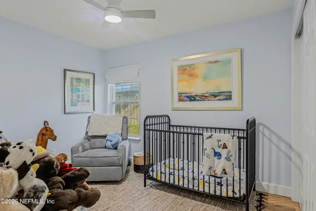 a bedroom with furniture and a window
