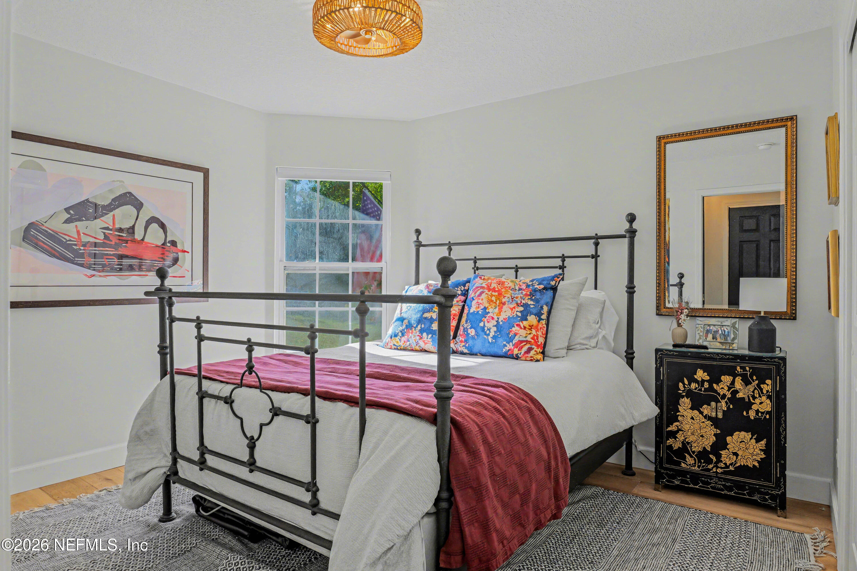 87159 Chesapeake Avenue Yulee, FL 32097 - Photo 31 of 46 a bedroom with a bed and a window