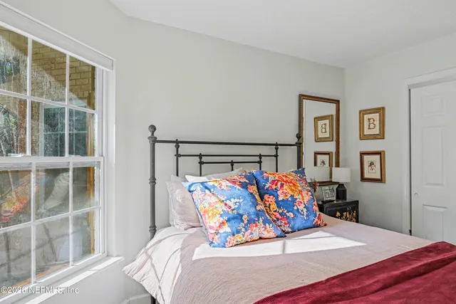 a bed room with a bed and a television