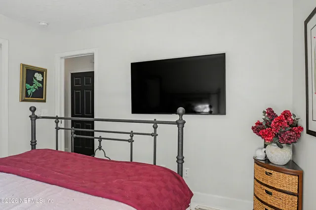 a view of a livingroom with workspace and a window