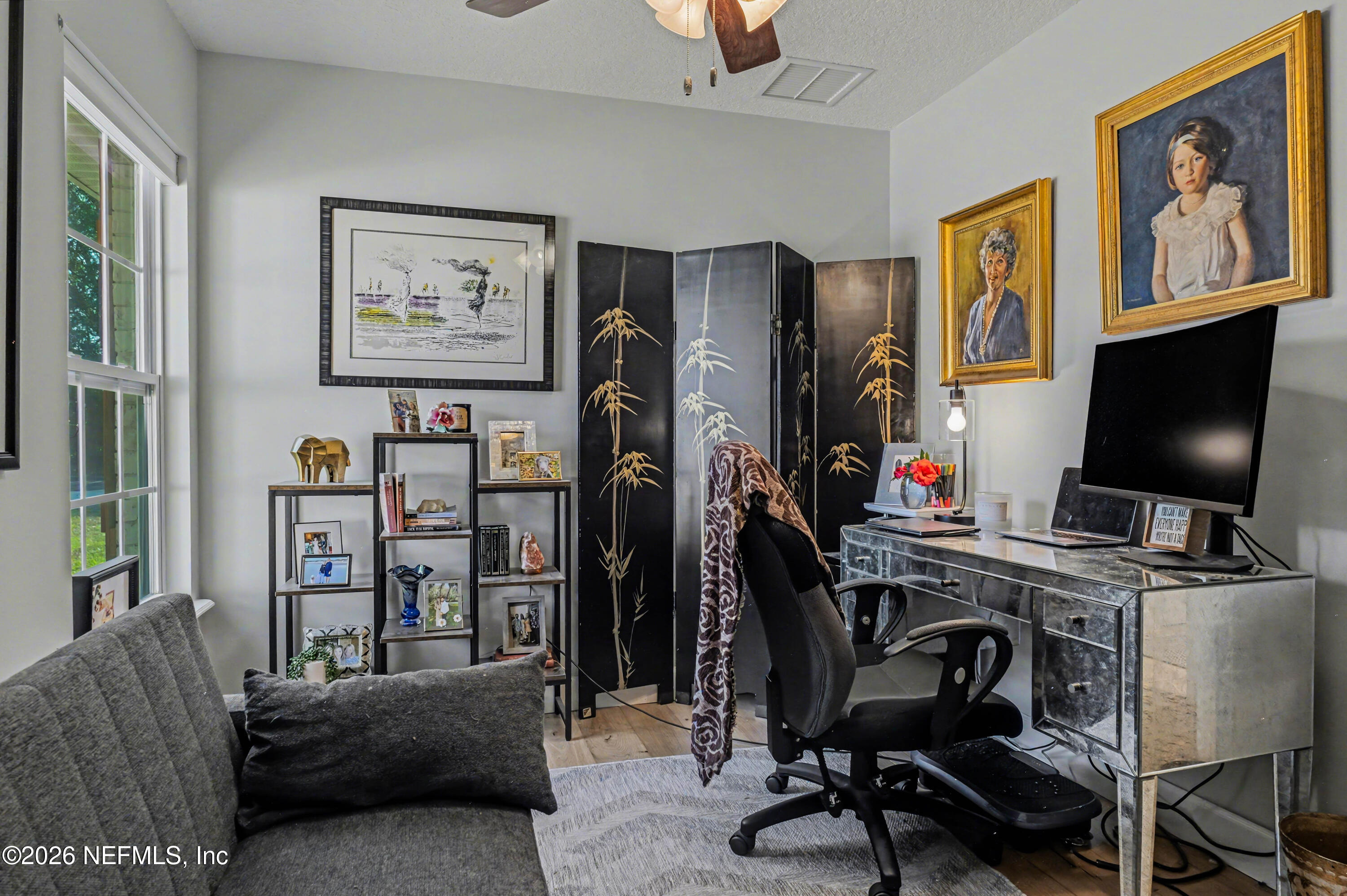 87159 Chesapeake Avenue Yulee, FL 32097 - Photo 34 of 46 a view of a livingroom with workspace and a window