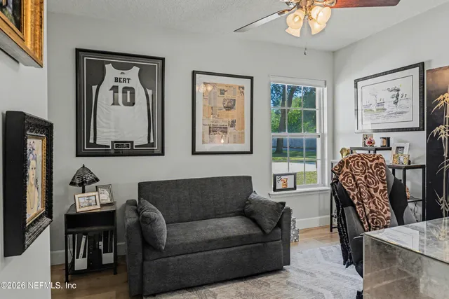 a bedroom with furniture and a rug