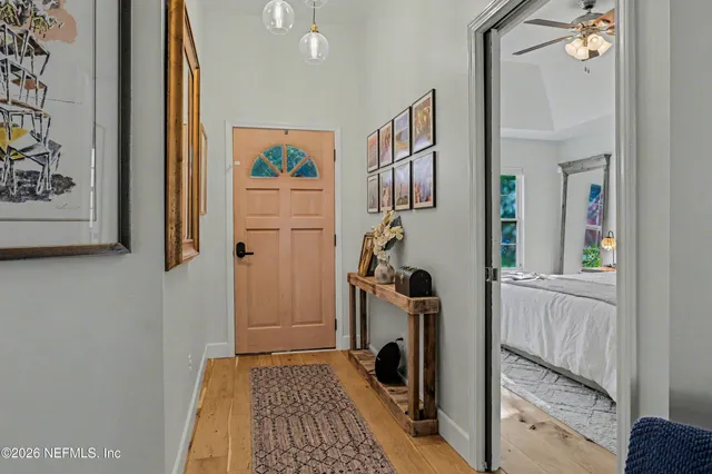 a view of a bedroom with washer and dryer