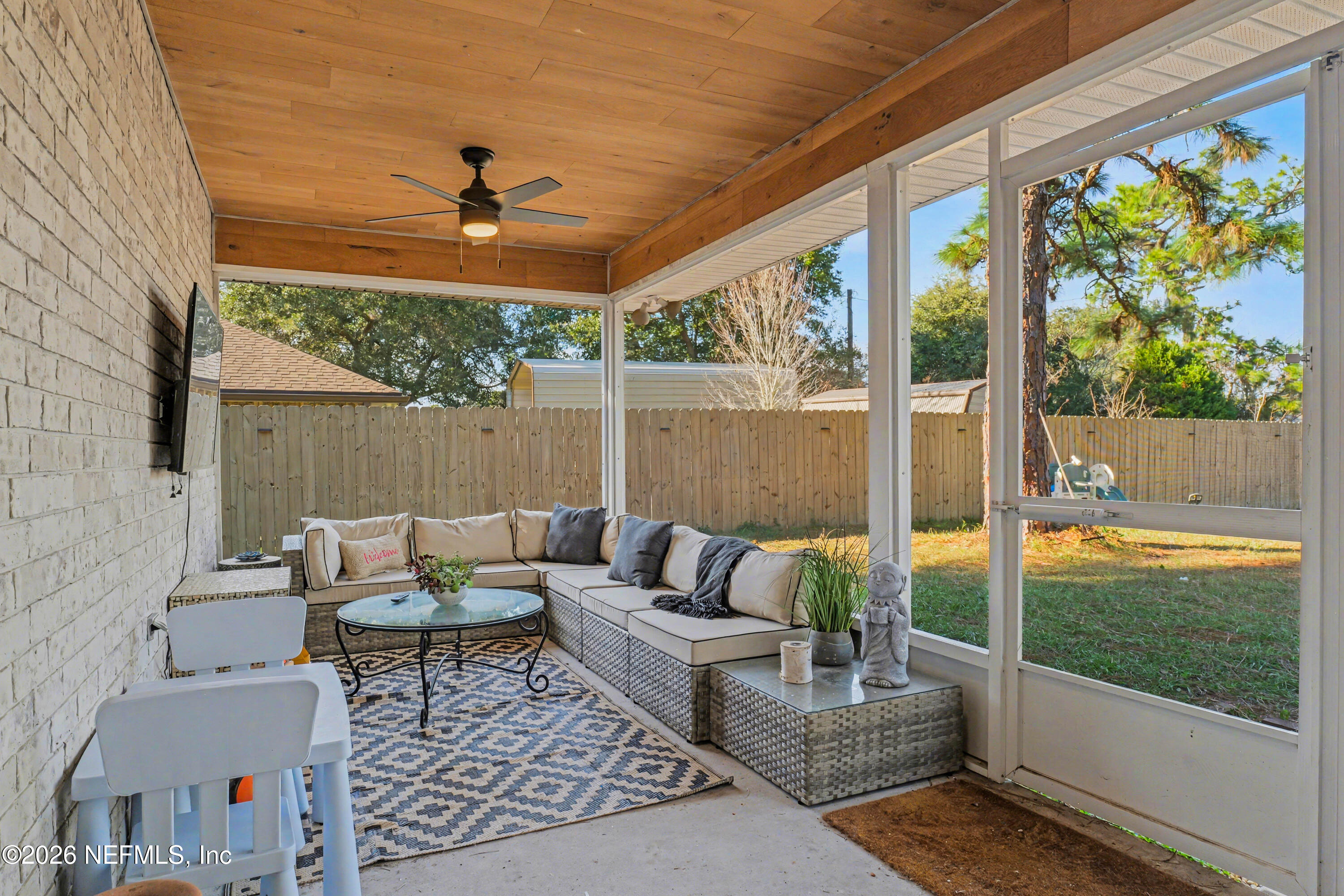 87159 Chesapeake Avenue Yulee, FL 32097 - Photo 41 of 46 a outdoor living space with furniture and garden view