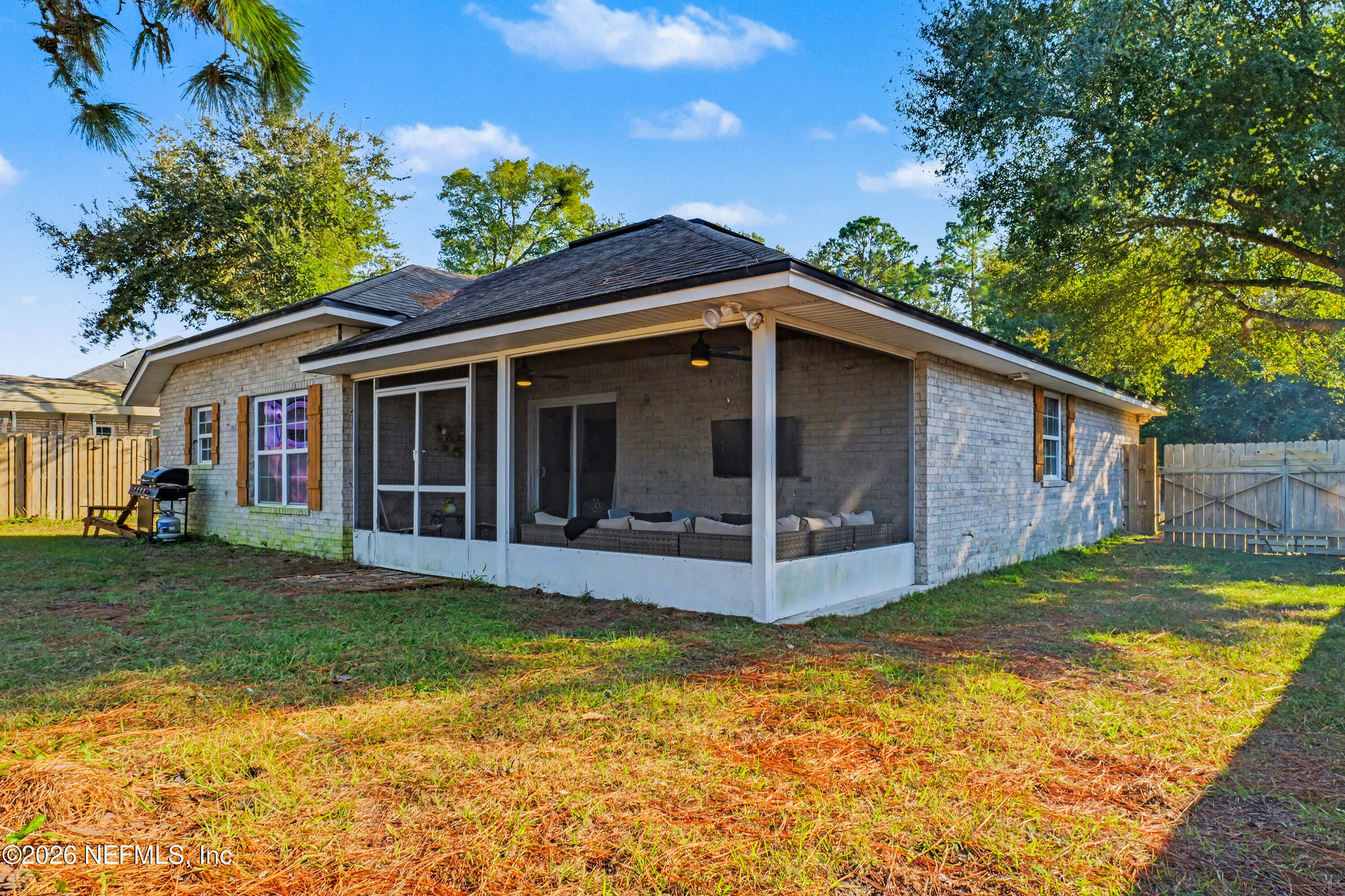87159 Chesapeake Avenue Yulee, FL 32097 - Photo 43 of 46 a view of a house with a yard