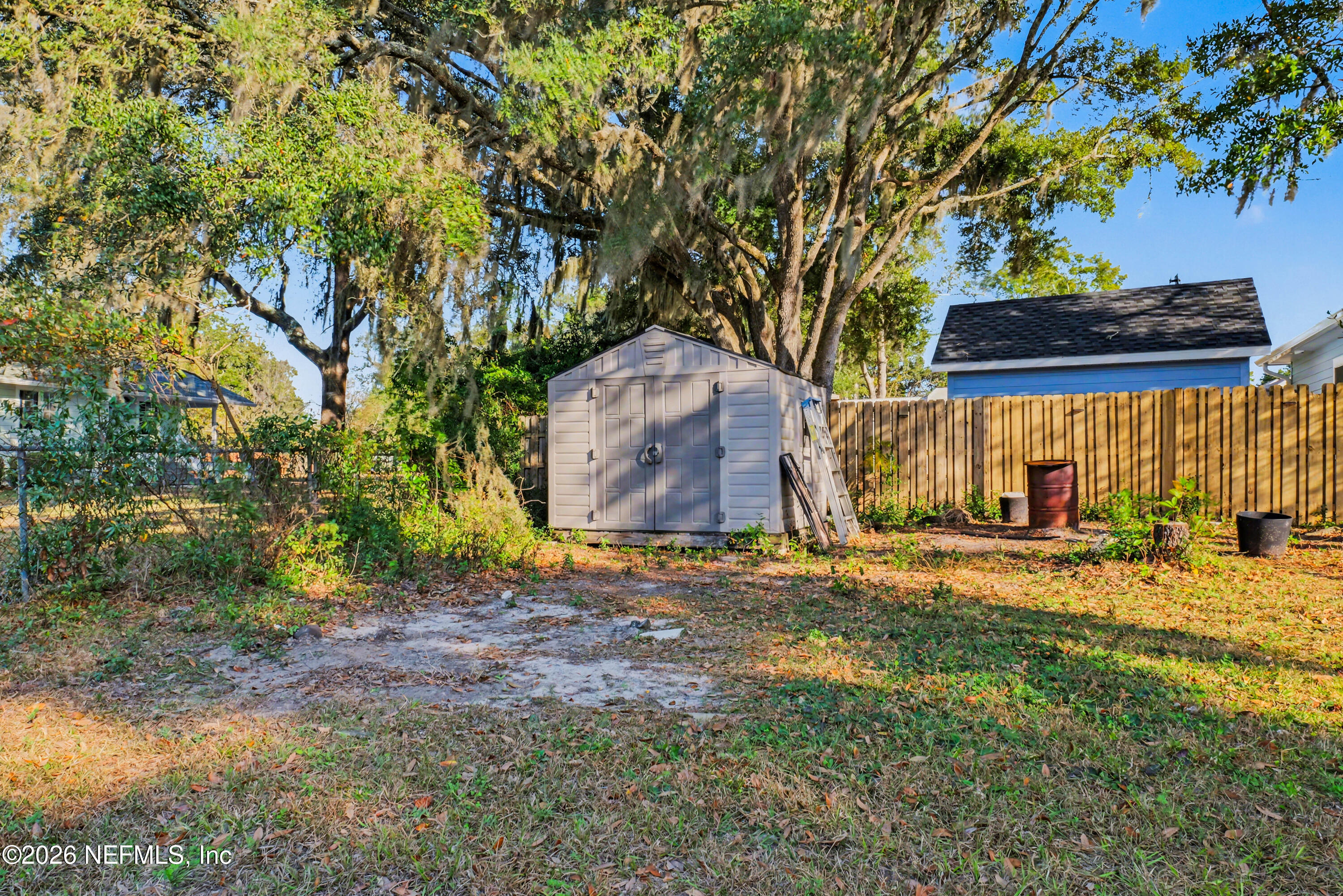87159 Chesapeake Avenue Yulee, FL 32097 - Photo 45 of 46 a backyard of a house with lots of green space
