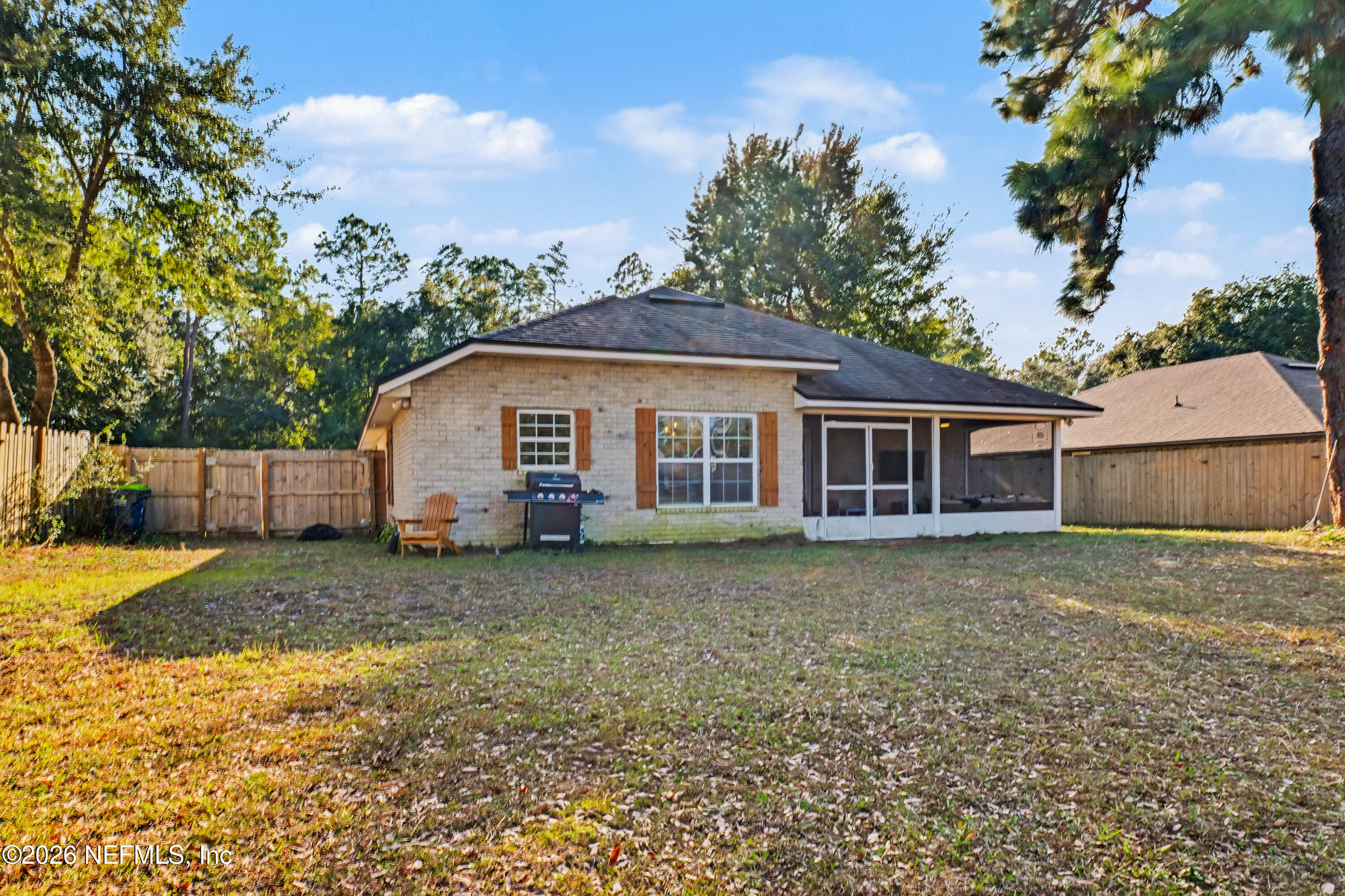 87159 Chesapeake Avenue Yulee, FL 32097 - Photo 46 of 46 a view of a yard in front of a house with large trees
