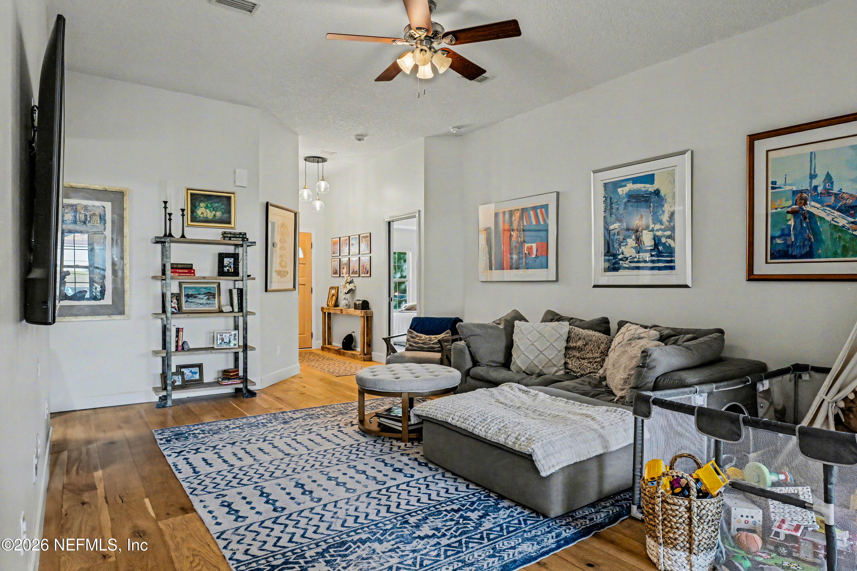 87159 Chesapeake Avenue Yulee, FL 32097 - Photo 5 of 46 a living room with furniture and wooden floor