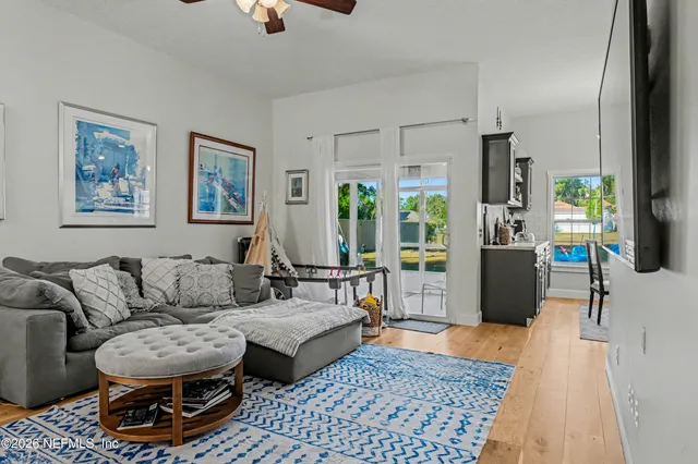 a living room with furniture and a rug