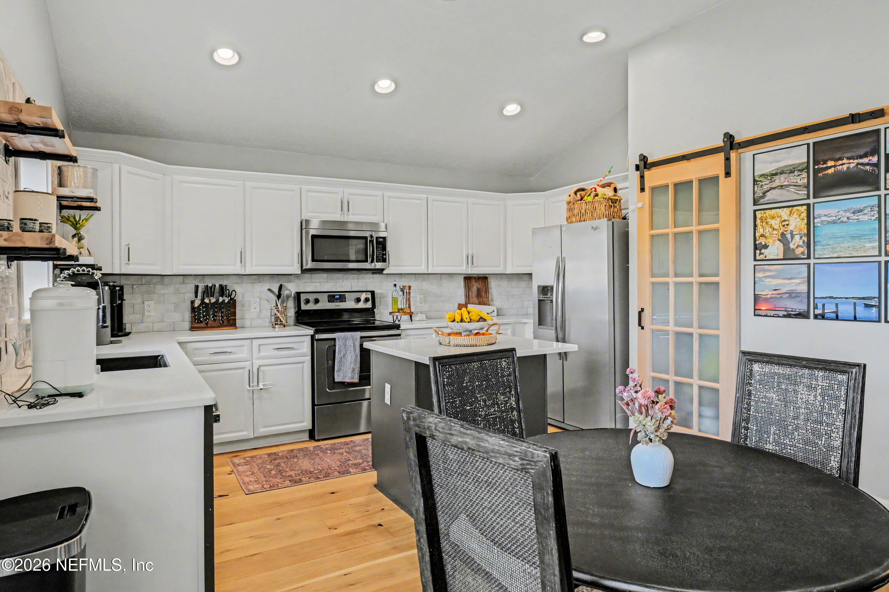 87159 Chesapeake Avenue Yulee, FL 32097 - Photo 10 of 46 a kitchen with granite countertop lots of counter top space appliances and cabinets