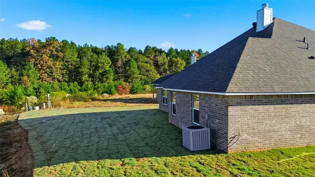 swimming pool view with a seating space