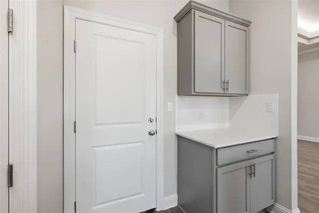 a view of cabinets and wooden floor