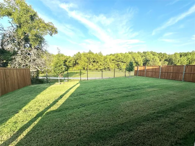 a view of a golf course with a lake