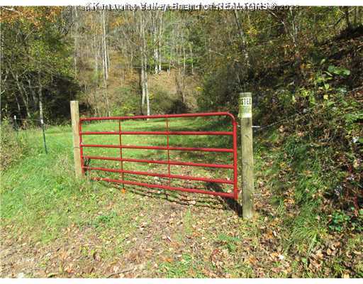 0 Lynn Fork Road Elkview, WV 25071 - Photo 2 of 15 Land. THIS IS THE 2ND. RED GATE PAST THE MAIN ENTRANCE, FENCE LINE WILL START UP HILL AT CORNER, WATER WELL ON THIS SECTION.