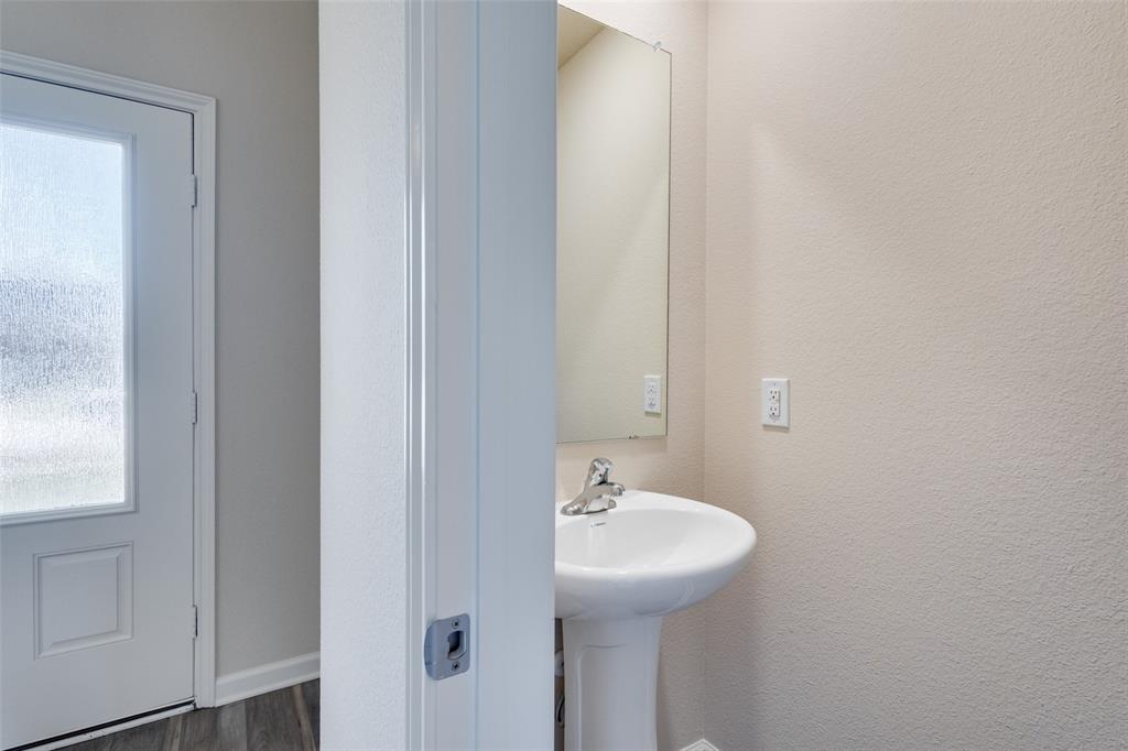 2256 Cashmere Way Princeton, TX 75407 - Photo 15 of 36 a bathroom with a sink and mirror
