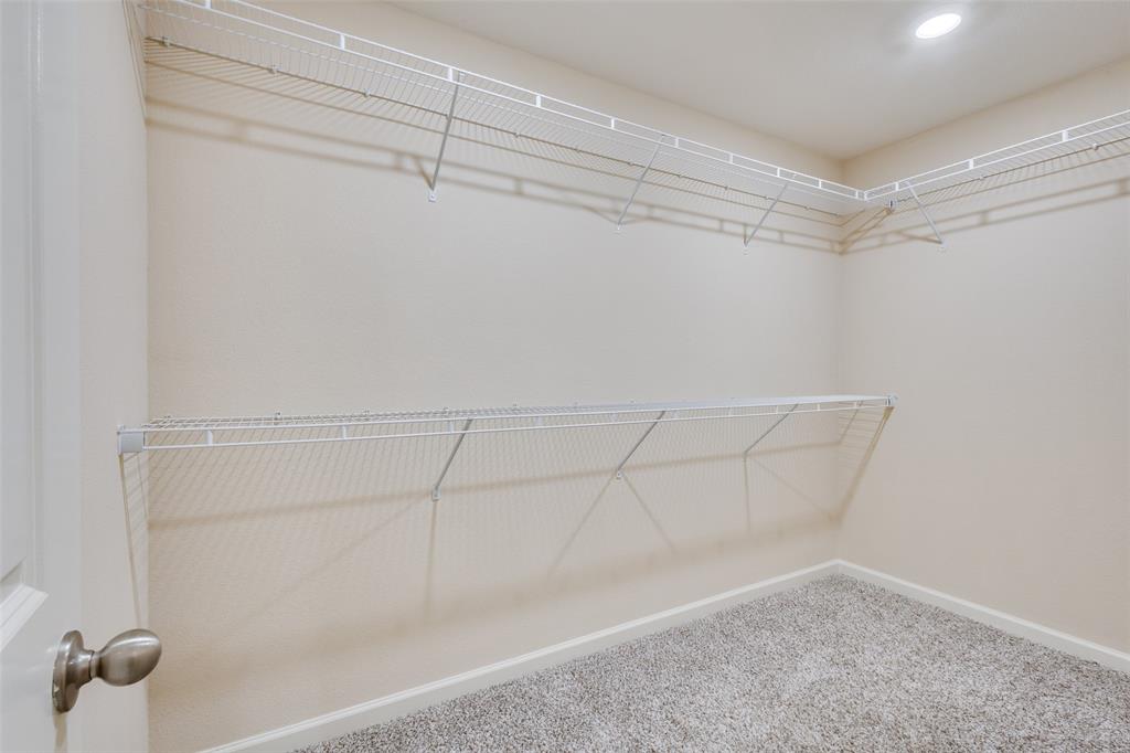 2256 Cashmere Way Princeton, TX 75407 - Photo 20 of 36 a view of a room with racks on the wall