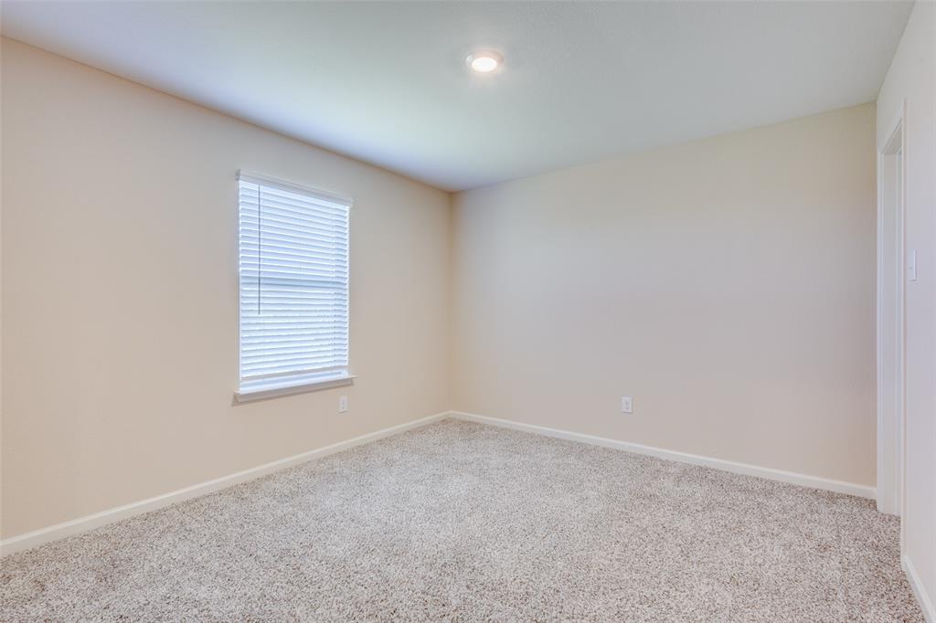 2256 Cashmere Way Princeton, TX 75407 - Photo 23 of 36 an empty room with a window
