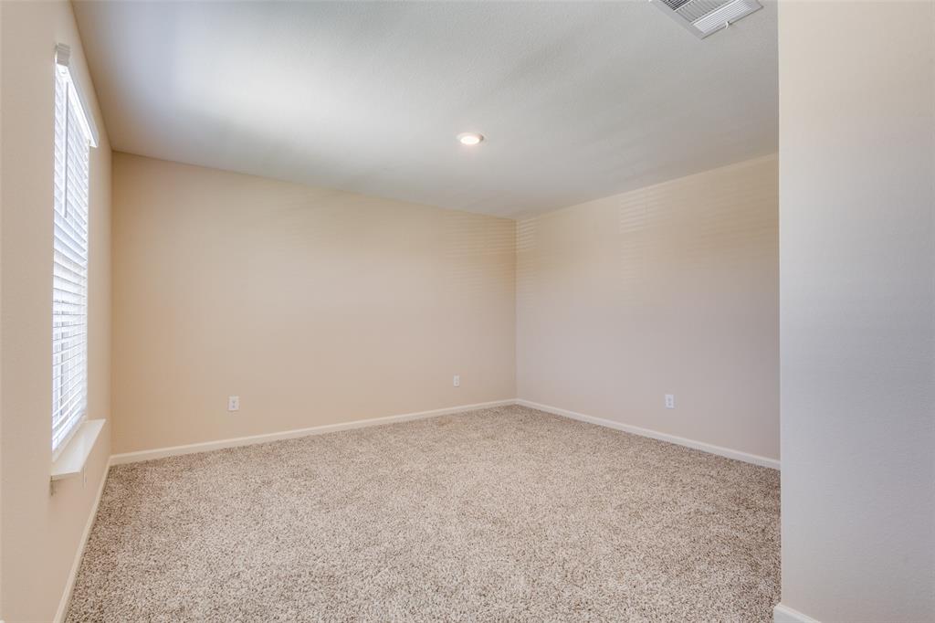 2256 Cashmere Way Princeton, TX 75407 - Photo 24 of 36 an empty room with a natural light
